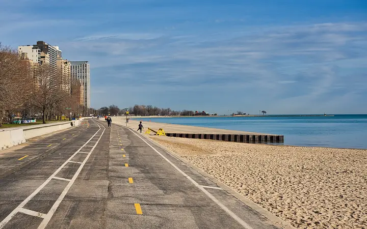 The Lakefront Trail running beside Oak Street Beach and Lake Michigan, with high-rises on the left.
